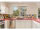 Kitchen with a large window over the sink, providing natural light and views of the outdoors at 9812 E Karen Dr, Scottsdale, AZ 85260