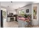 Bright kitchen with stainless steel appliances, tiled floor, and breakfast bar at 9812 E Karen Dr, Scottsdale, AZ 85260