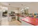 Updated kitchen featuring modern appliances, colorful backsplash, and easy outdoor access at 9812 E Karen Dr, Scottsdale, AZ 85260