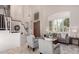 Inviting living room featuring high ceilings, neutral décor, and an abundance of natural light at 9812 E Karen Dr, Scottsdale, AZ 85260