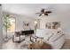 Relaxing living room with a ceiling fan and natural light at 9812 E Karen Dr, Scottsdale, AZ 85260