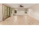 Open living room featuring tile flooring, neutral paint, and a sliding door leading outside at 9812 E Karen Dr, Scottsdale, AZ 85260