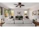 Comfortable living room with a ceiling fan and views to the backyard at 9812 E Karen Dr, Scottsdale, AZ 85260