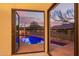 Inviting outdoor pool with a clear view from the open patio doors at 9812 E Karen Dr, Scottsdale, AZ 85260