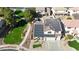 Aerial view of home with solar panels, landscaped yard, and neighborhood at 10322 W Edgemont Dr, Avondale, AZ 85392