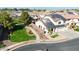 Aerial view of home with solar panels, landscaped yard, and community at 10322 W Edgemont Dr, Avondale, AZ 85392