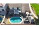 Aerial view of the backyard featuring a pool, patio, and meticulous landscaping at 10322 W Edgemont Dr, Avondale, AZ 85392