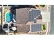 Aerial view of home featuring a pool, solar panels and manicured landscaping at 10322 W Edgemont Dr, Avondale, AZ 85392