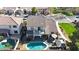 Stunning aerial view of the home showcasing the backyard pool and outdoor living spaces at 10322 W Edgemont Dr, Avondale, AZ 85392