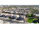 Aerial view of a residential neighborhood showcasing well-maintained homes and green spaces on a sunny day at 10322 W Edgemont Dr, Avondale, AZ 85392