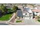 Aerial view of home with solar panels, landscaped yard, and neighborhood at 10322 W Edgemont Dr, Avondale, AZ 85392