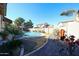 Lush backyard with a refreshing pool and well-manicured landscaping at 10322 W Edgemont Dr, Avondale, AZ 85392