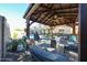 Gazebo in backyard patio area with outdoor seating, a fire pit, landscaping, and open views at 10322 W Edgemont Dr, Avondale, AZ 85392