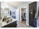 Beautifully designed bathroom featuring a modern vanity and access to the shower at 10322 W Edgemont Dr, Avondale, AZ 85392