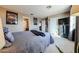 Comfortable bedroom featuring carpeted floor, and large closet with open doorway to the Primary bathroom at 10322 W Edgemont Dr, Avondale, AZ 85392