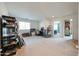Large upstairs bonus room with neutral carpet and great natural light at 10322 W Edgemont Dr, Avondale, AZ 85392