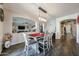 Dining room features pendant lighting and a view into the living room at 10322 W Edgemont Dr, Avondale, AZ 85392