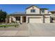 Inviting home featuring a well-manicured yard and solar panels at 10322 W Edgemont Dr, Avondale, AZ 85392