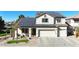 Beautiful two-story home showcasing solar panels, desert landscaping, and a welcoming entrance at 10322 W Edgemont Dr, Avondale, AZ 85392