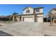 Spacious home featuring a three-car garage and solar panels at 10322 W Edgemont Dr, Avondale, AZ 85392
