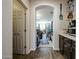 Hallway featuring a pantry and view into a craft room space at 10322 W Edgemont Dr, Avondale, AZ 85392