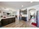 Open-concept kitchen with an island, lots of counter space, and dark cabinets at 10322 W Edgemont Dr, Avondale, AZ 85392