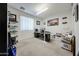 Office featuring natural light and ample work space with built-in desk and shelves at 10322 W Edgemont Dr, Avondale, AZ 85392