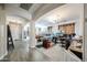 Open room with wood floors and a large shelving unit at 10322 W Edgemont Dr, Avondale, AZ 85392