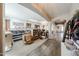Open room with wood floors and a large shelving unit at 10322 W Edgemont Dr, Avondale, AZ 85392