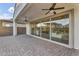 Expansive back patio showcasing large sliding glass doors leading into the home's open living space at 10719 E Simone Ave, Mesa, AZ 85212