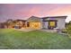 A serene backyard with an outdoor seating area and beautiful landscaping, perfect for relaxing at 10719 E Simone Ave, Mesa, AZ 85212