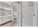 Modern bathroom featuring a glass-enclosed shower, double vanity, and neutral color palette at 10719 E Simone Ave, Mesa, AZ 85212
