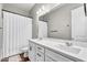 Bathroom featuring double sinks, a large mirror, and a shower with a white curtain at 10719 E Simone Ave, Mesa, AZ 85212