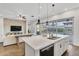 Modern kitchen with a large island, stainless steel appliances, and an open concept layout at 10719 E Simone Ave, Mesa, AZ 85212