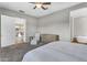 Spacious main bedroom offering an ensuite bathroom, neutral colors, and carpeted floors at 10719 E Simone Ave, Mesa, AZ 85212