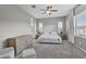 Bright main bedroom with neutral colors, carpeted floors, and large windows at 10719 E Simone Ave, Mesa, AZ 85212