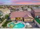 A beautiful backyard featuring a private pool, patio, outdoor seating, and lush landscaping, perfect for outdoor living at 10722 E Keats Ave, Mesa, AZ 85209