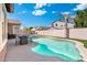 Inviting backyard with a sparkling pool, outdoor seating, and mature trees at 10722 E Keats Ave, Mesa, AZ 85209