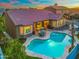 A view of a beautiful backyard featuring a private pool, patio, outdoor seating, and lush landscaping, perfect for entertaining at 10722 E Keats Ave, Mesa, AZ 85209