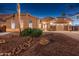 Beautiful home exterior showcasing desert landscaping, a charming walkway, and mature palm trees at 10722 E Keats Ave, Mesa, AZ 85209