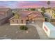 Charming single-story home with well-manicured front yard and convenient three-car garage at 10722 E Keats Ave, Mesa, AZ 85209