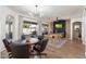 Spacious game room with a pool table, dining area, and large windows at 10722 E Keats Ave, Mesa, AZ 85209