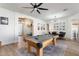 Open floor plan with a game room, home office and entry way featuring a beautiful pool table at 10722 E Keats Ave, Mesa, AZ 85209