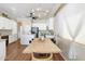 Eat-in kitchen features a wooden table and decorative chandelier creating an inviting atmosphere at 10722 E Keats Ave, Mesa, AZ 85209