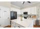 Bright kitchen featuring a large island, stainless steel appliances and a pantry at 10722 E Keats Ave, Mesa, AZ 85209