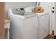 Well-maintained laundry room with modern appliances and decorative elements at 10722 E Keats Ave, Mesa, AZ 85209