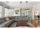Open living room design featuring a large comfortable gray sectional sofa at 10722 E Keats Ave, Mesa, AZ 85209