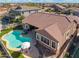 Aerial view of a private pool, landscaping and an outdoor patio, enhancing the home's appeal for relaxation and entertainment at 10722 E Keats Ave, Mesa, AZ 85209