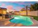 A sparkling pool that adds a touch of luxury to outdoor living spaces, complete with a dining set for entertaining at 10722 E Keats Ave, Mesa, AZ 85209
