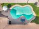 Top-down shot of a sparkling pool with a tanning ledge, alongside a cozy outdoor seating area at 10722 E Keats Ave, Mesa, AZ 85209